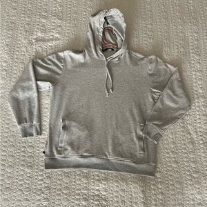 Heather gray Travis Mathew hoodie with pockets, size Medium